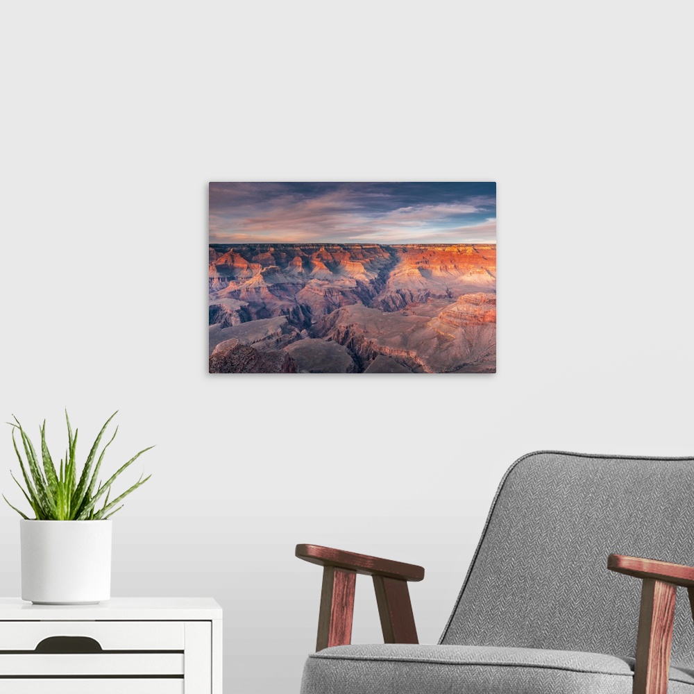 A modern room featuring Layered bands of red rock glowing in sunset in the South Rim of Grand Canyon National Park, Arizona.