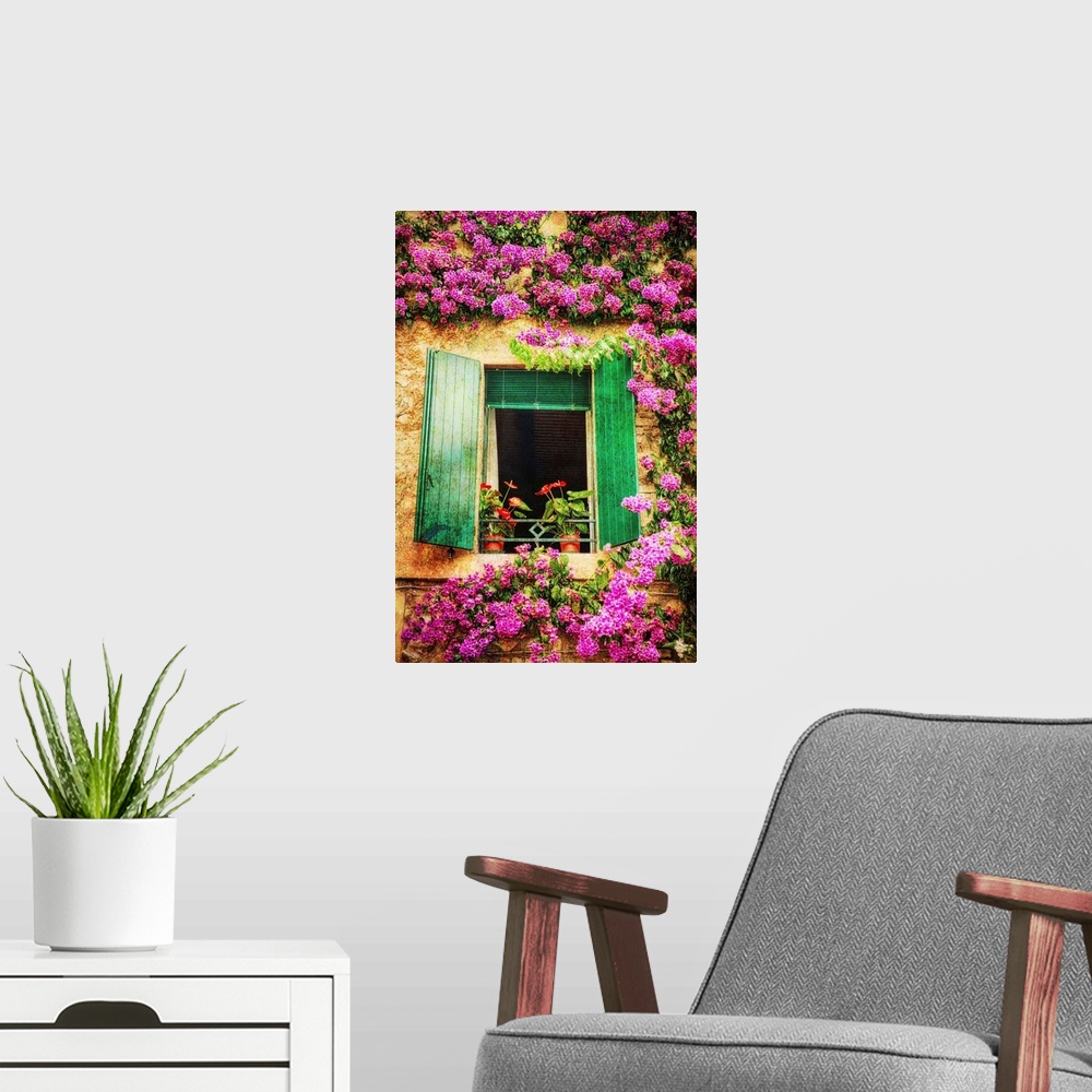 A modern room featuring Green shutters on a window surrounded by vibrant pink flowers growing on the wall.