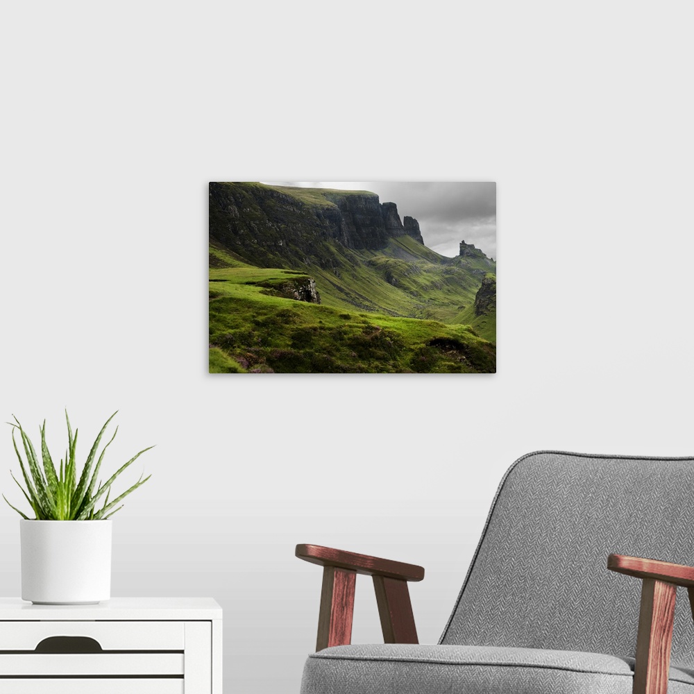 A modern room featuring Fine art photo of a misty valley surrounded by steep cliffs.