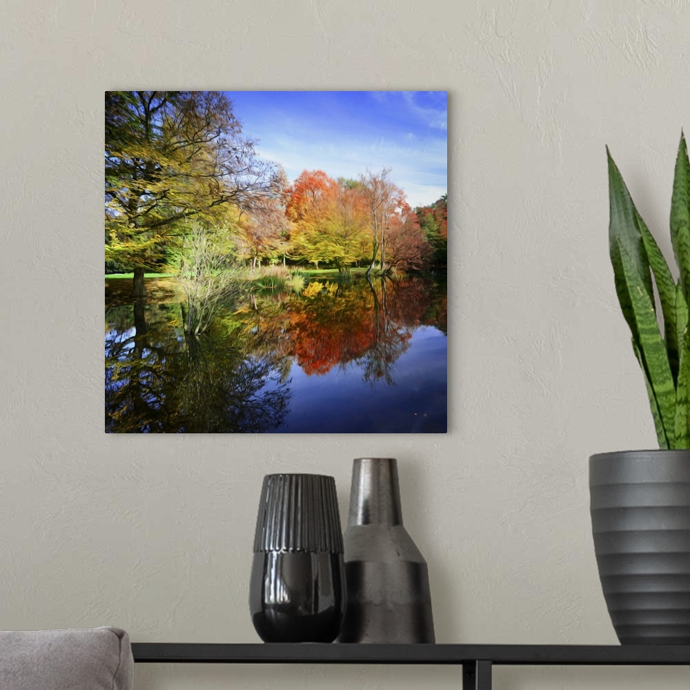 A modern room featuring Forest in autumn at the edge of a lake