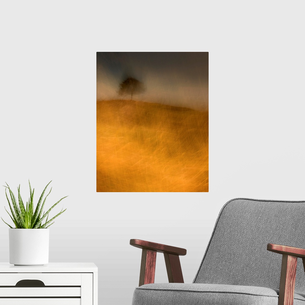 A modern room featuring An impressionistic image of a lone tree in a storm on a small hill in a field of golden grasses.