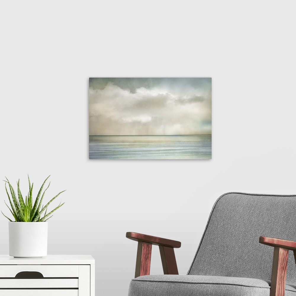 A modern room featuring Cloudscape manipulated image of clouds over the ocean on a sunny morning.