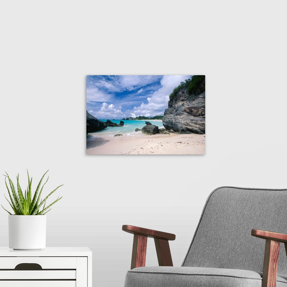 A modern room featuring Big photograph displays a secluded portion of a sandy beach in Horseshoe Bay, Bermuda on a sunny ...
