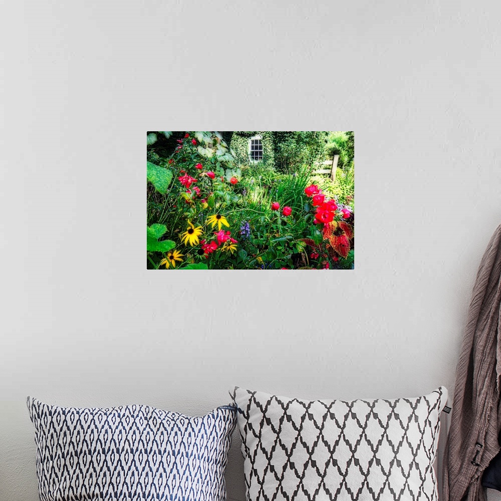 A bohemian room featuring Large wall art of garden Flowers blooming in Willowwood Arboretum.