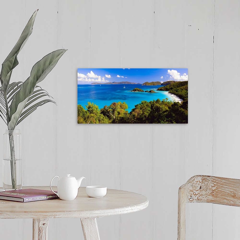 A farmhouse room featuring Panoramic photograph of cove with water on left and tree lined beach on right.  There are vegetat...