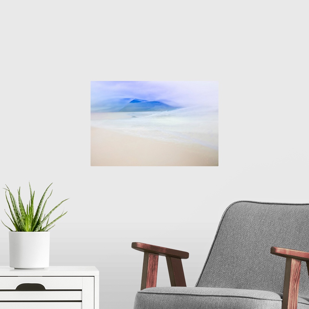 A modern room featuring Abstract landscape photo with the ocean faintly washing up on a sandy shore and blue silhouetted ...