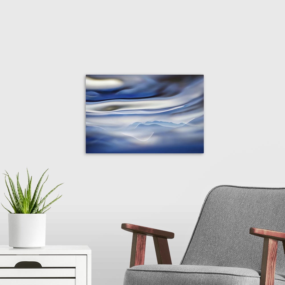 A modern room featuring Sweeping mountains by water, framed by clouds faintly resembling a raven.