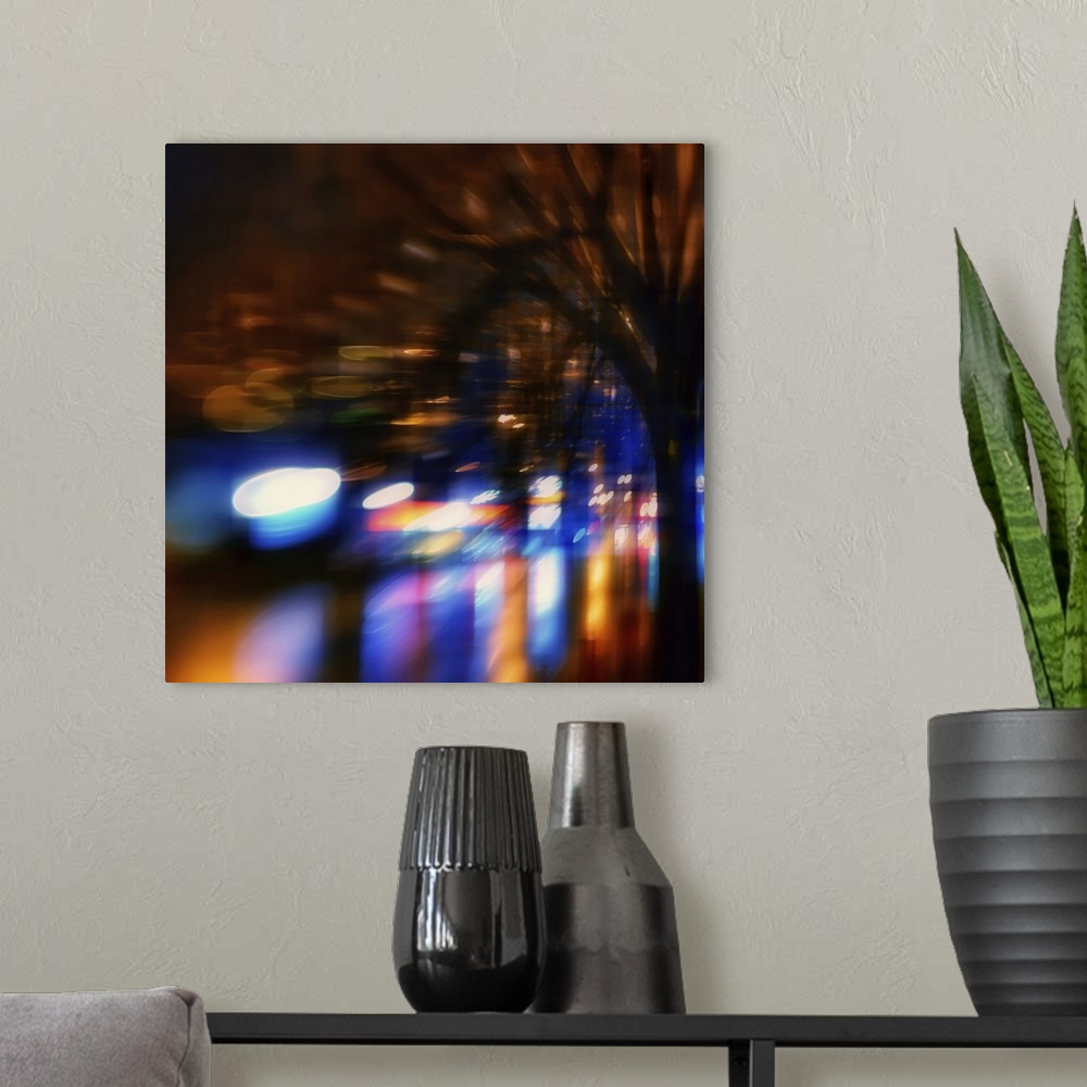 A modern room featuring Lights from shops and cars in an urban environment at night, warped and blurred to create an abst...