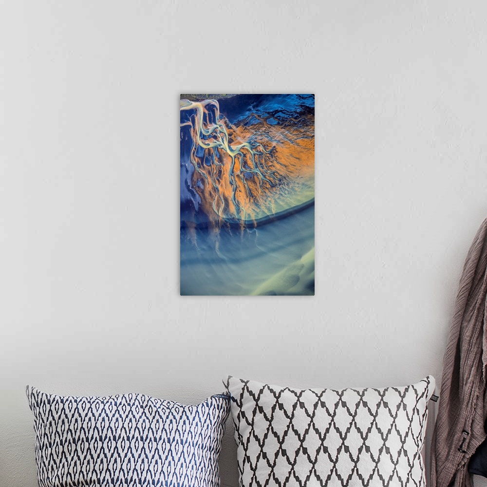 A bohemian room featuring Aerial view of a river delta in Iceland, creating an abstract image.