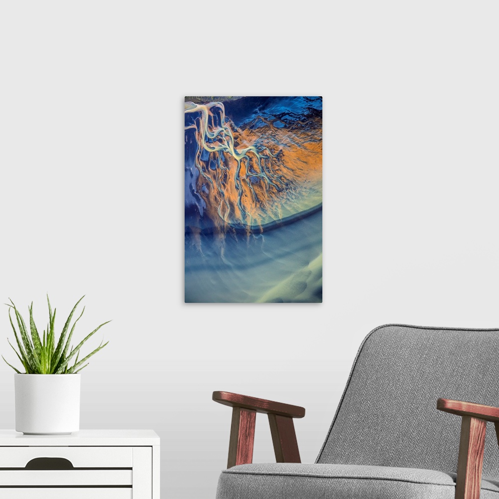A modern room featuring Aerial view of a river delta in Iceland, creating an abstract image.