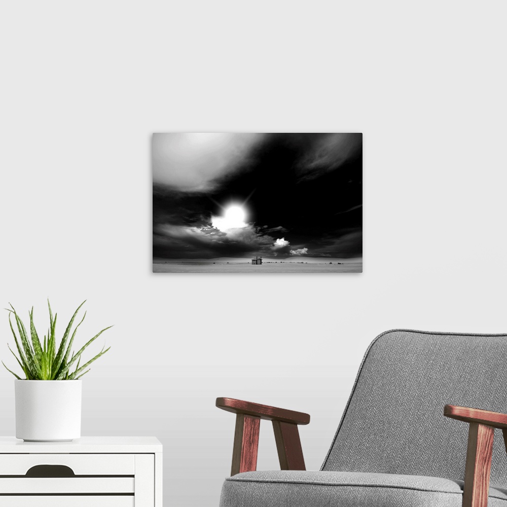 A modern room featuring Black and white landscape with a threatening sky