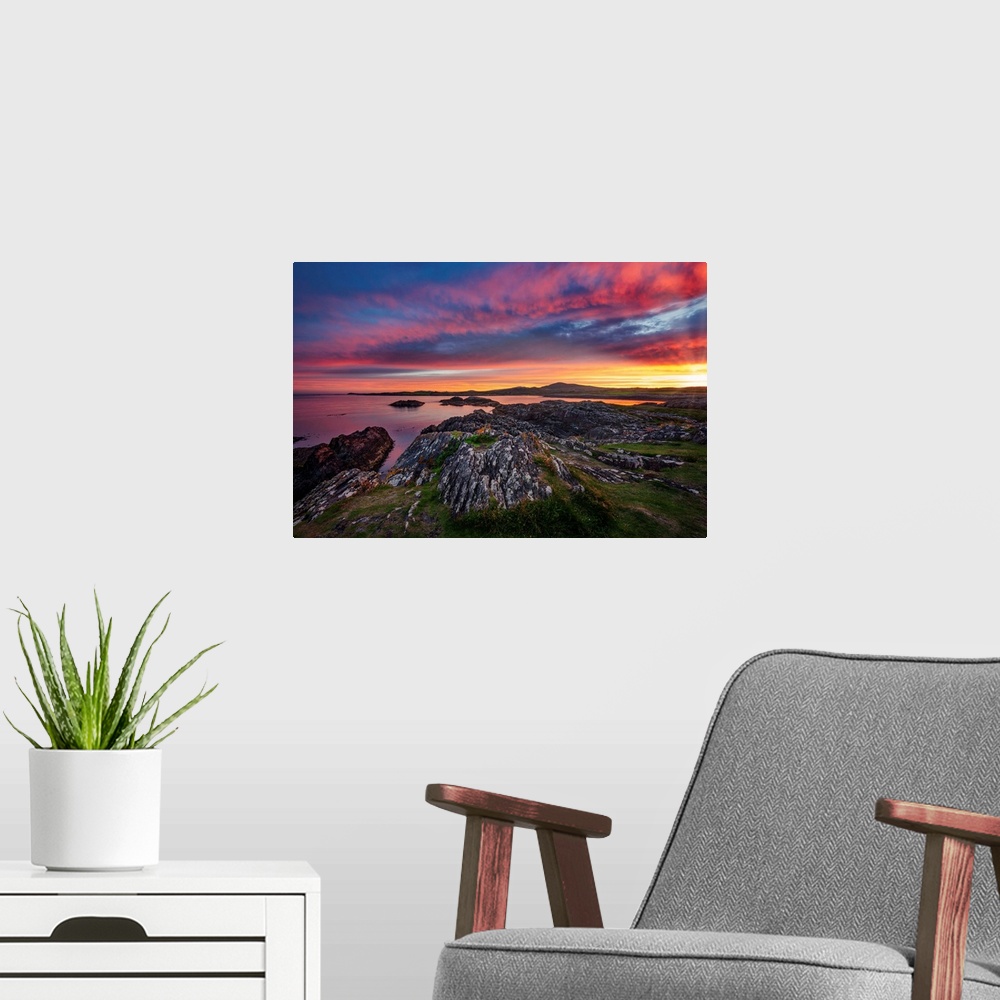 A modern room featuring Sunset with sky and red clouds