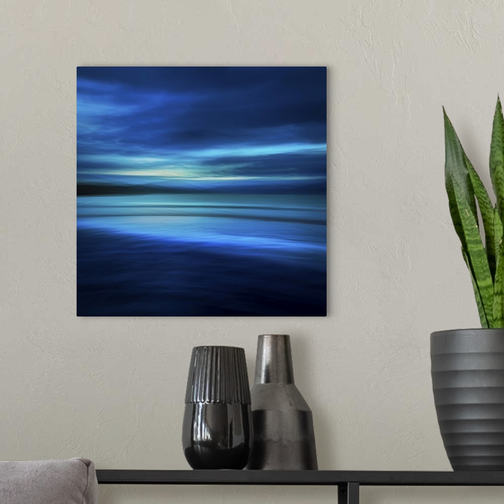 A modern room featuring Blue abstract seascape on a deserted beach at midnight in shades of navy blue and aqua.