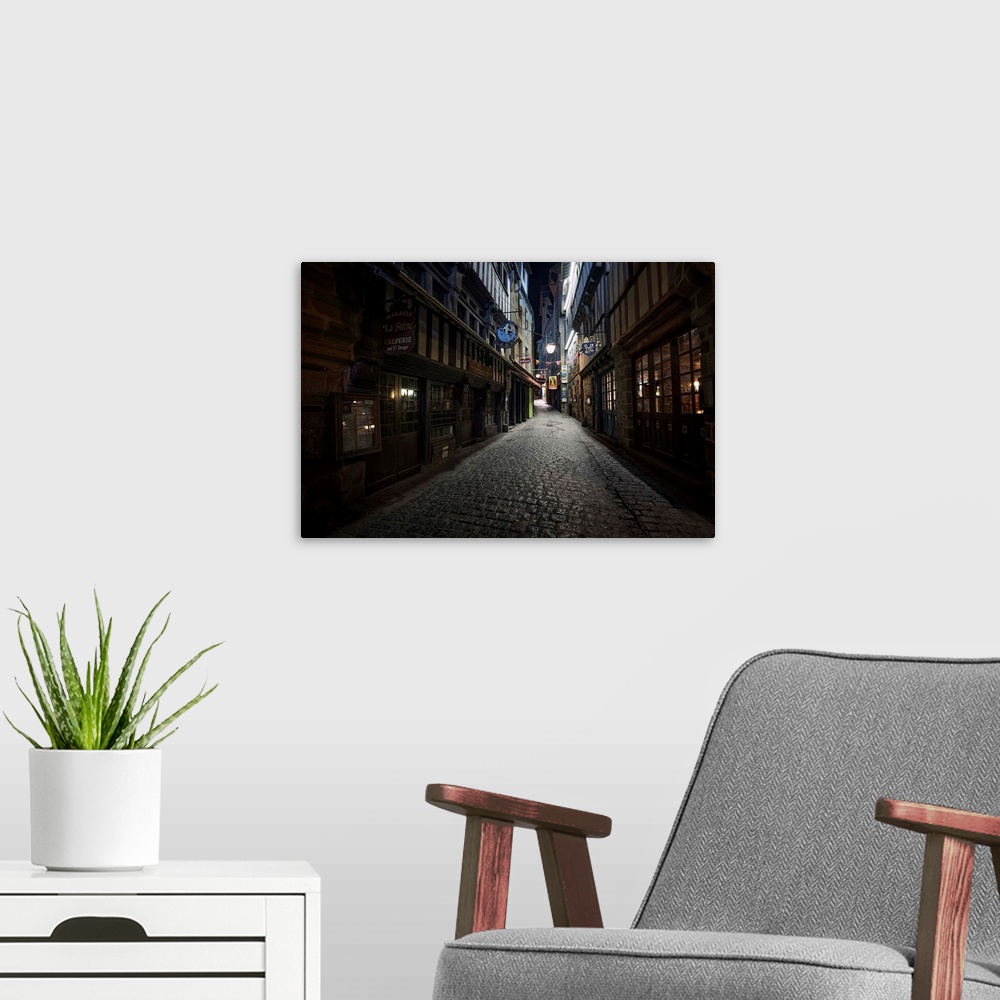 A modern room featuring Fine art photo of a dark alleyway with cobblestone  in France.