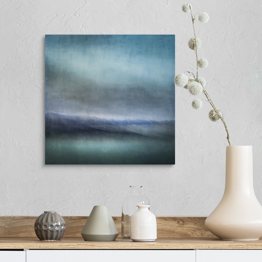 A farmhouse room featuring Blue landscape abstract of tiny islands receding into the distance with moody skies and dark teal...
