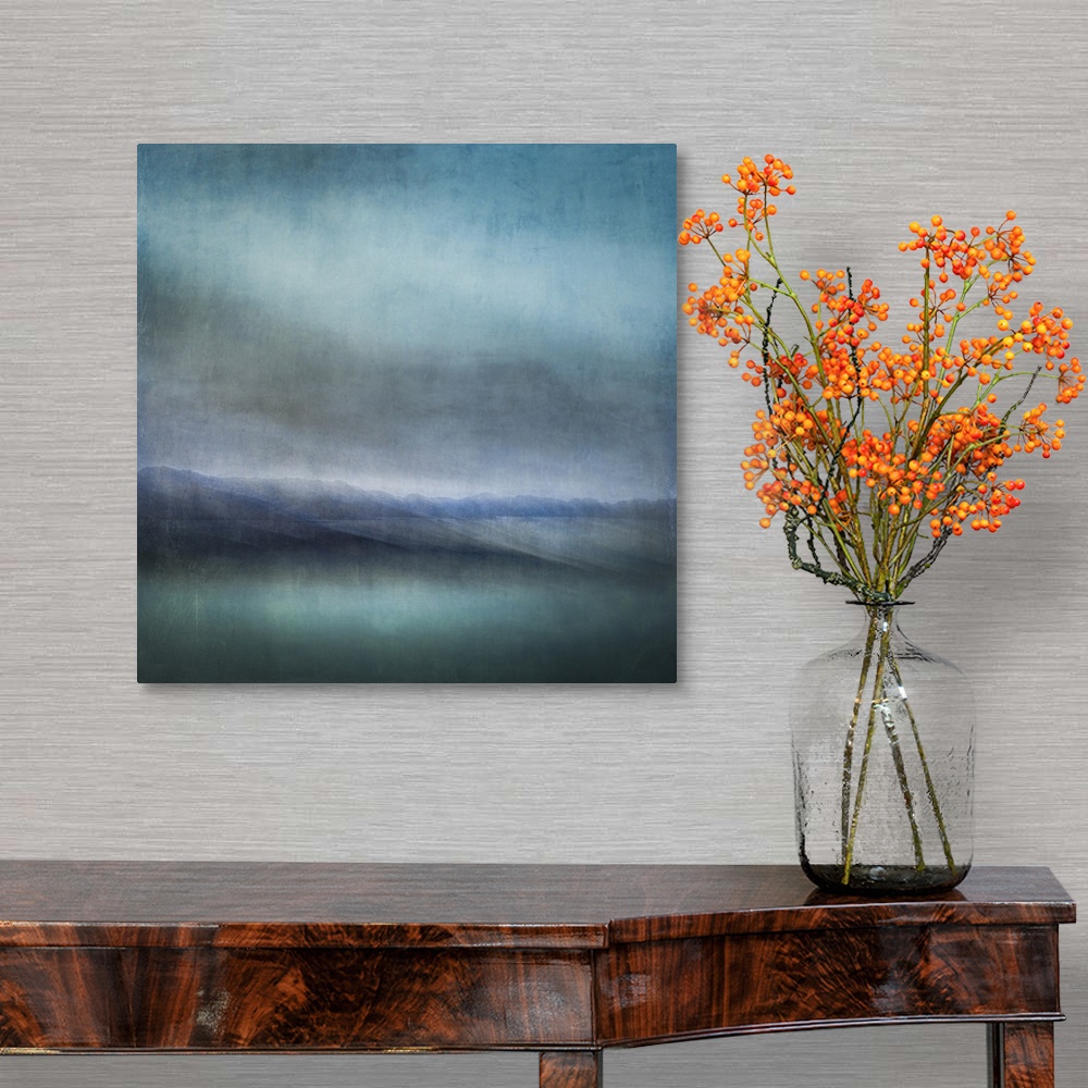 A traditional room featuring Blue landscape abstract of tiny islands receding into the distance with moody skies and dark teal...