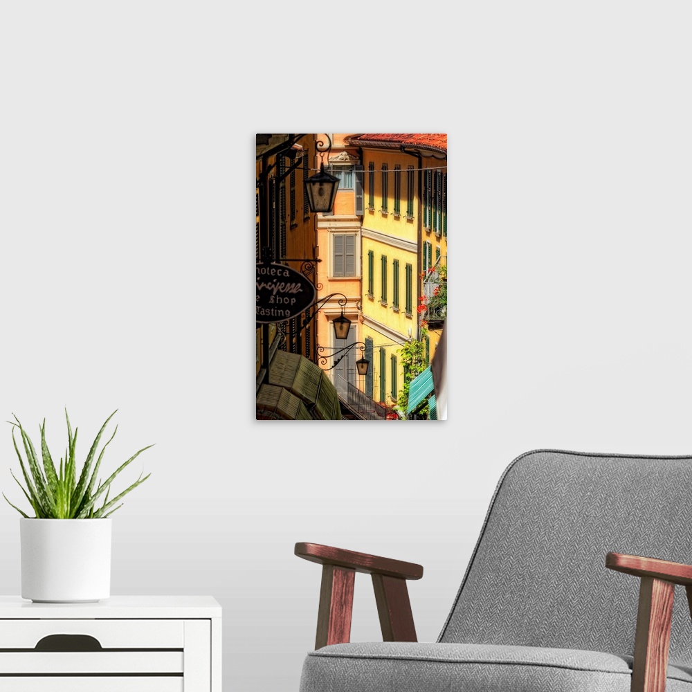 A modern room featuring Fine art photo of buildings in an alleyway in an Italian city.