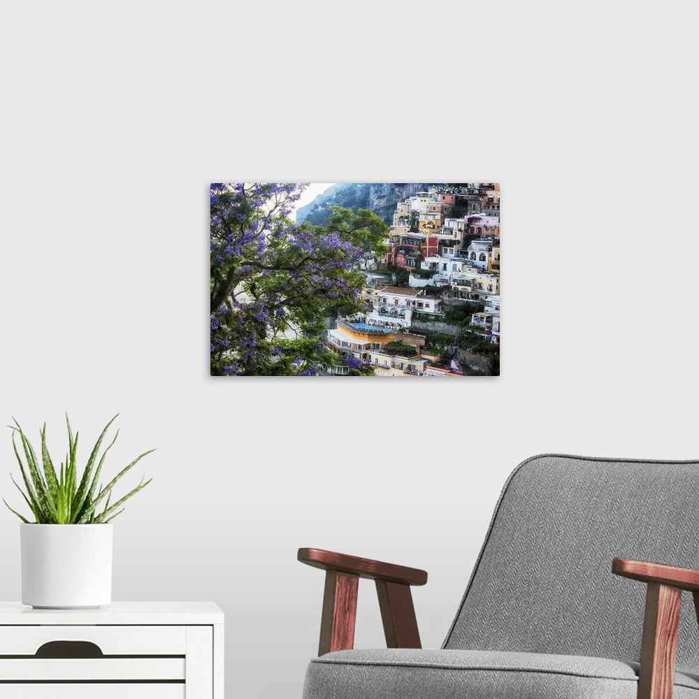 A modern room featuring High Angle View of Hillside Houses in Positano with a Blooming Jacaranda