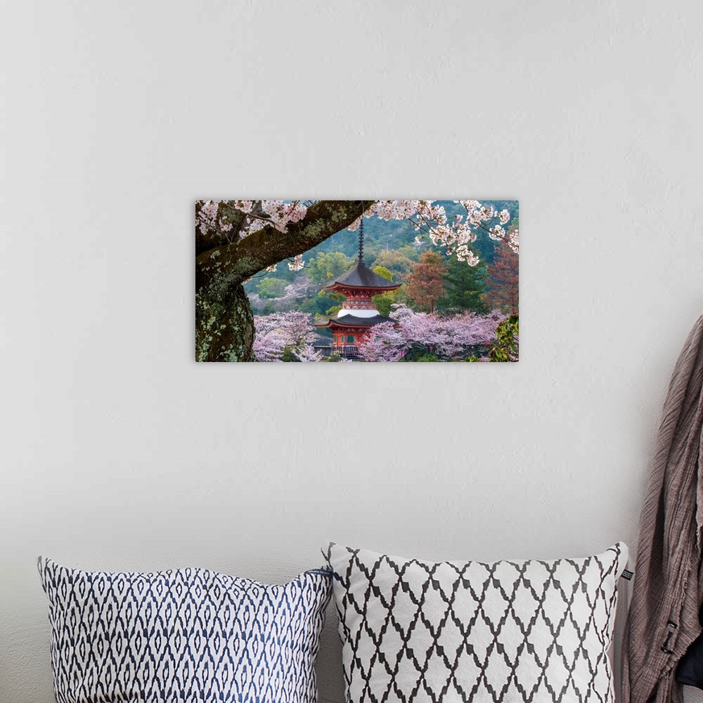 A bohemian room featuring Fine art photograph of a building in Japan surrounded by blossoming trees.