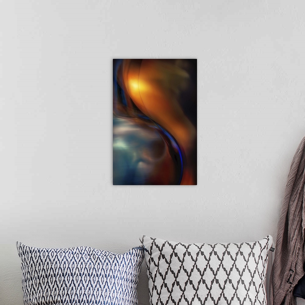 A bohemian room featuring Abstract photograph of curved blue glass against orange.