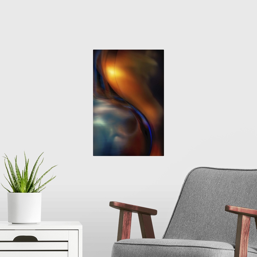 A modern room featuring Abstract photograph of curved blue glass against orange.