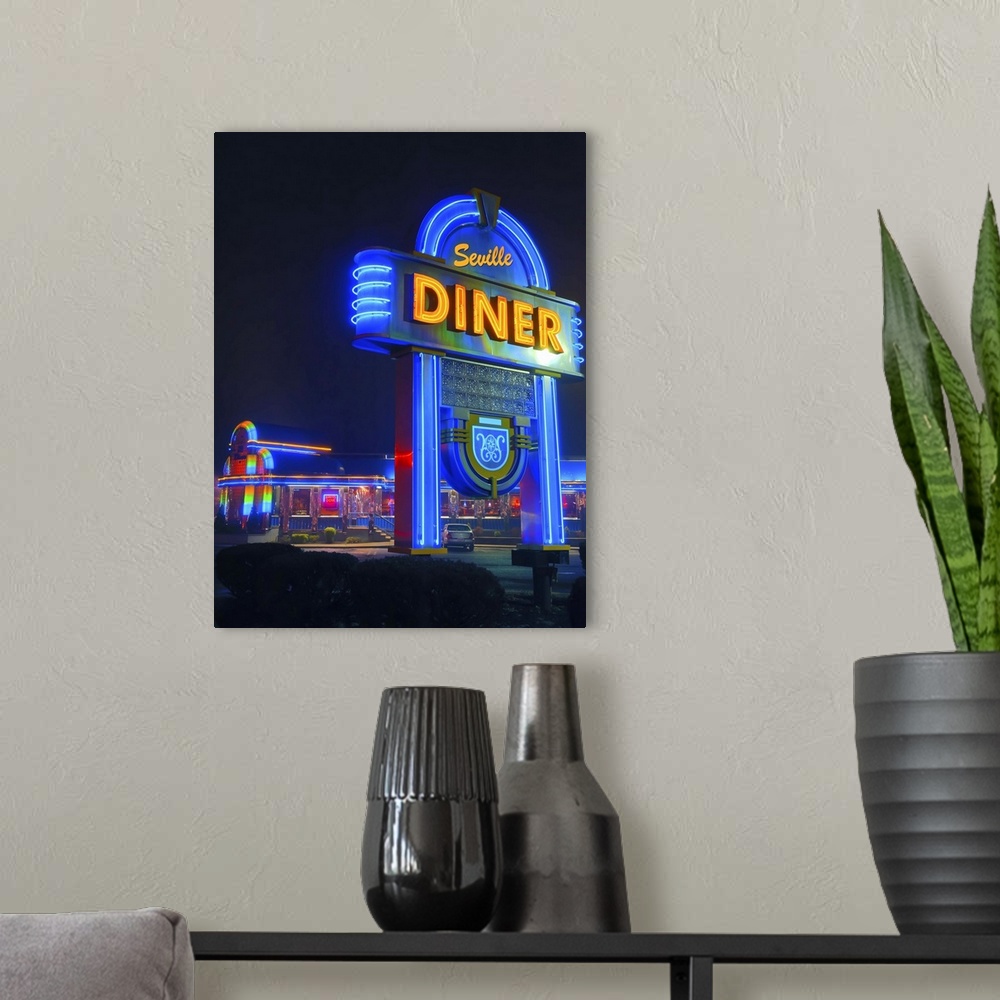 A modern room featuring Bright blue neon sign for a diner in New Jersey, illuminated at night.