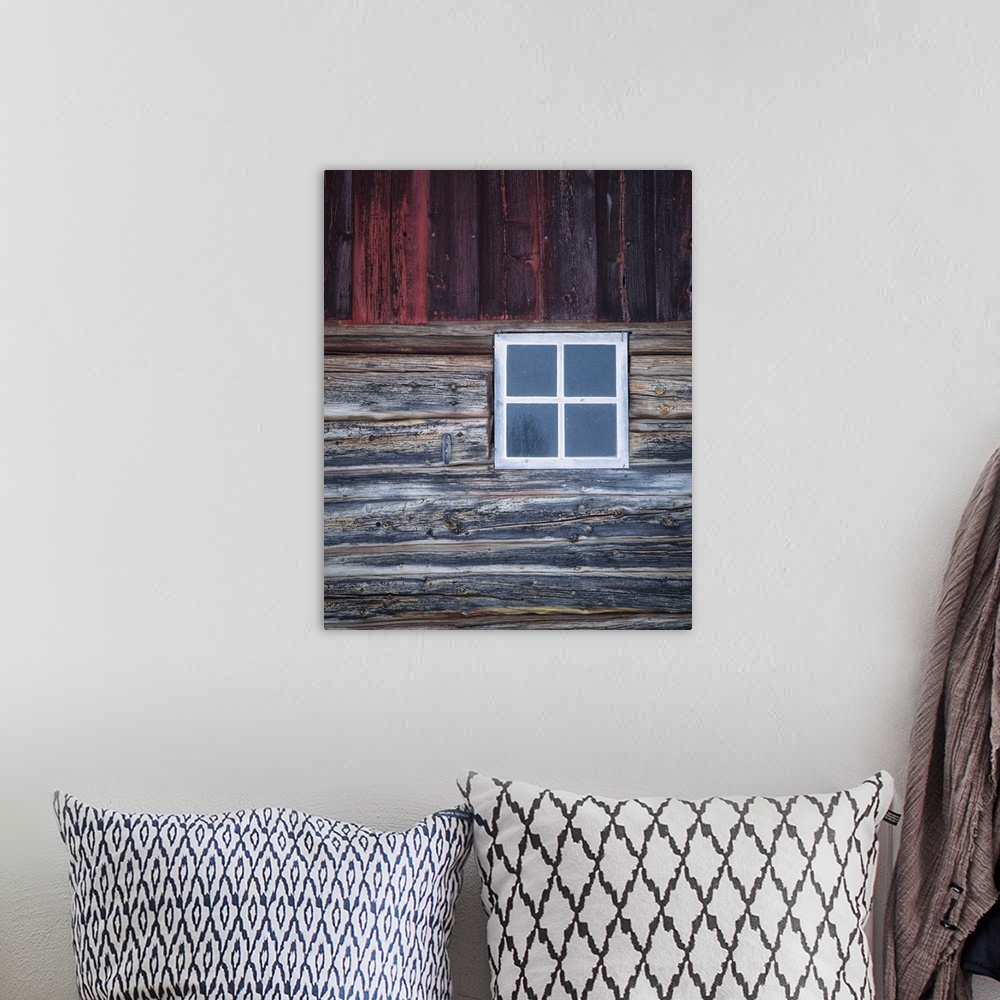 A bohemian room featuring A close-up of an old white window ina weather Norweigian wooden building in the snow with grey an...