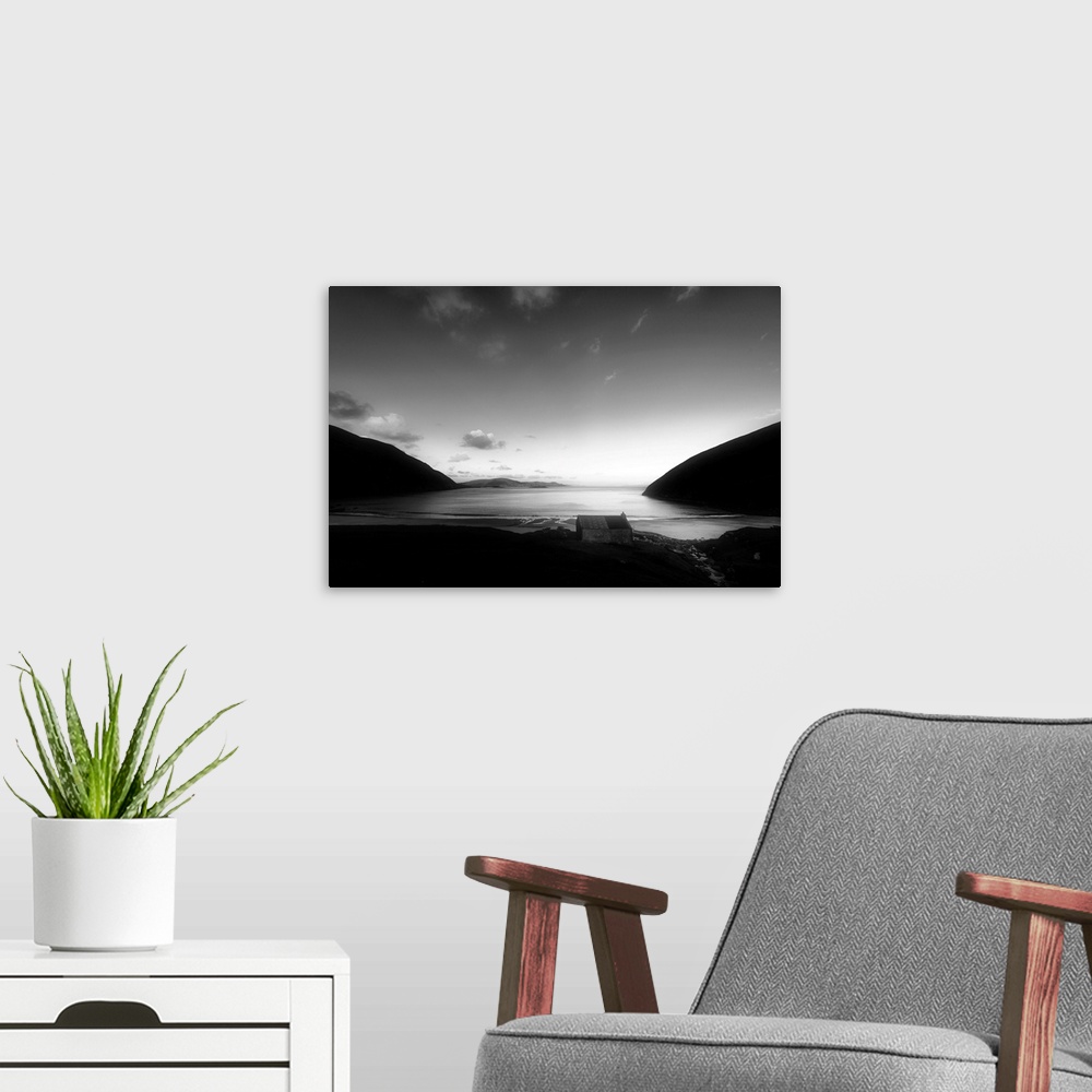 A modern room featuring Black and white landscape of a beach in Ireland