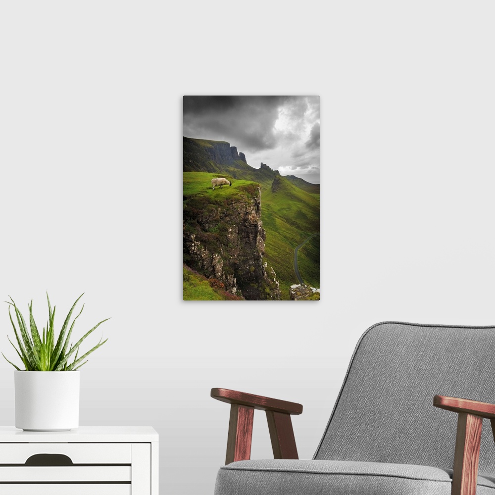 A modern room featuring Fine art photo of a misty valley surrounded by steep cliffs with a sheep on one ledge.