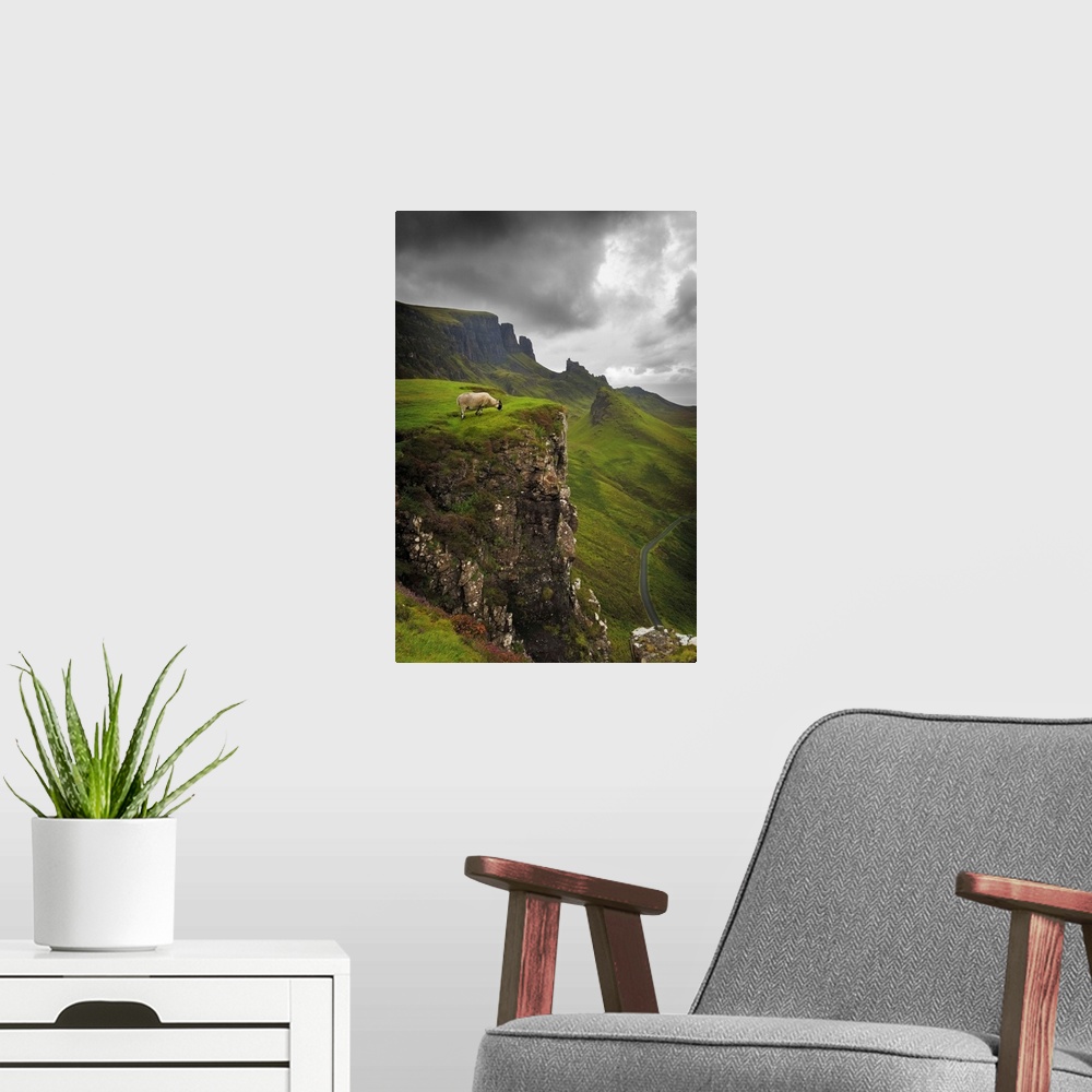 A modern room featuring Fine art photo of a misty valley surrounded by steep cliffs with a sheep on one ledge.