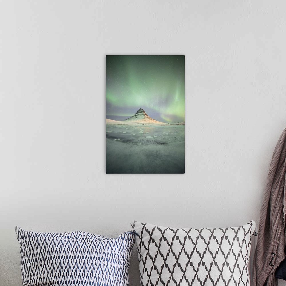 A bohemian room featuring Stunning northern lights in the sky illuminating Kirkjufell in Iceland at night.