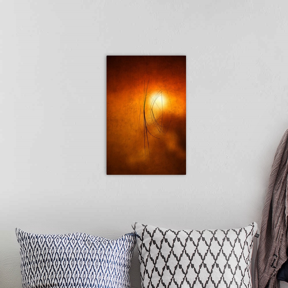 A bohemian room featuring Fine art photo of a few grasses in a pond with the setting sun in the background.