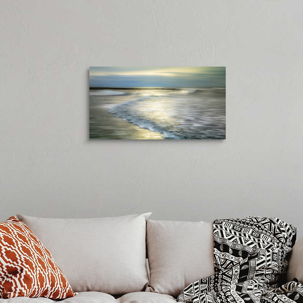 A bohemian room featuring A creative long exposure of the waves on the beach.