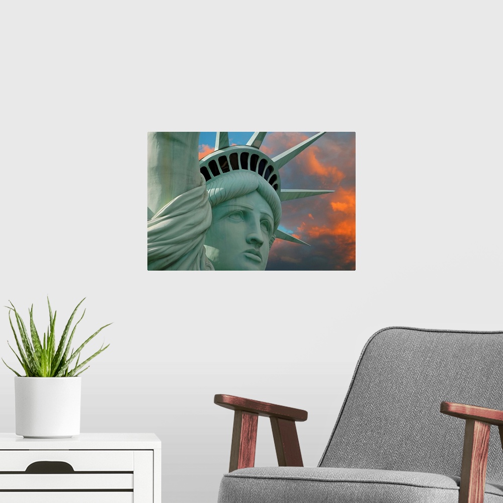 A modern room featuring Artistic photograph of the face and crown of the Statue of Liberty in New York with a stunning su...