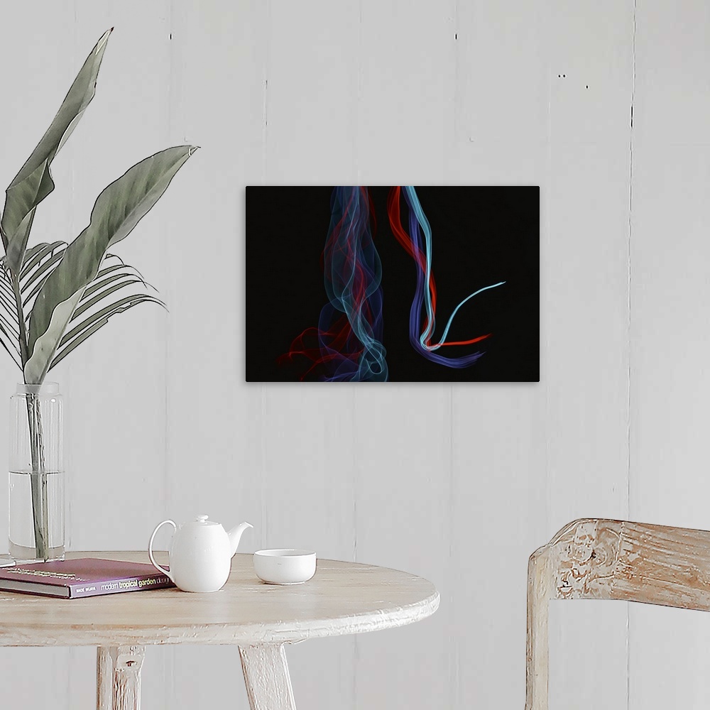 A farmhouse room featuring Abstract image created by trailing blue and red lights, resembling wisps of smoke.