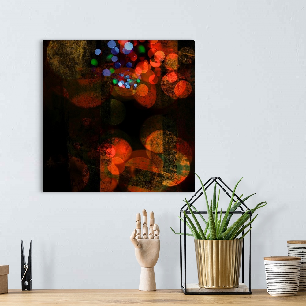 A bohemian room featuring Abstract photograph of blurred circles in bright colors of orange, red and blue.