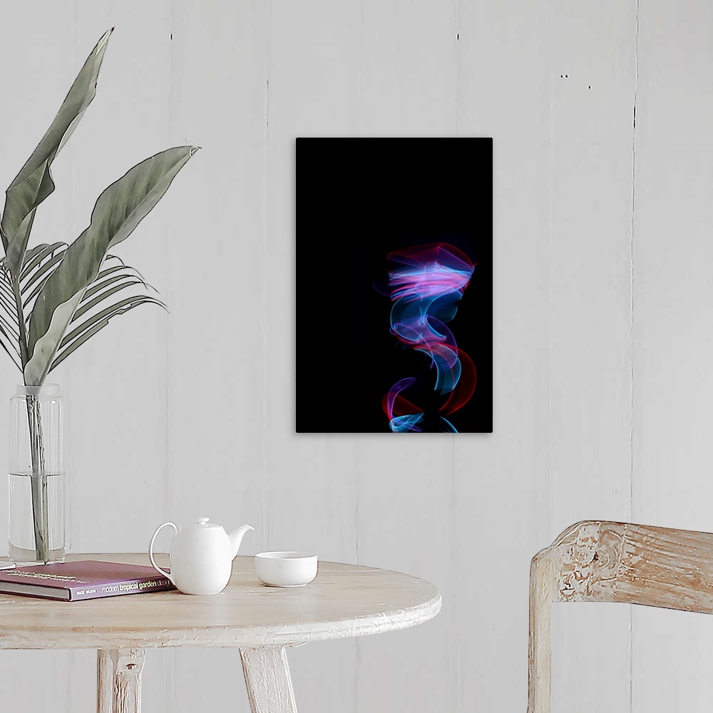 A farmhouse room featuring Abstract image created by trailing blue and red lights, resembling wisps of smoke.