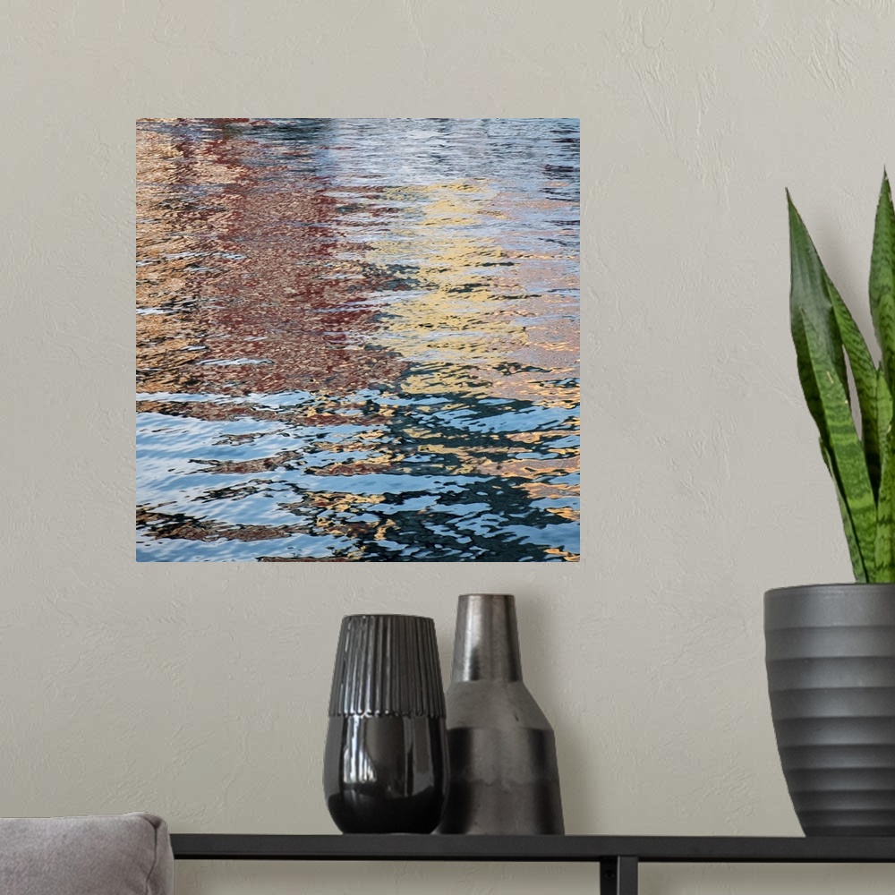 A modern room featuring Colorful reflections in rippling water of a pond in the fall.