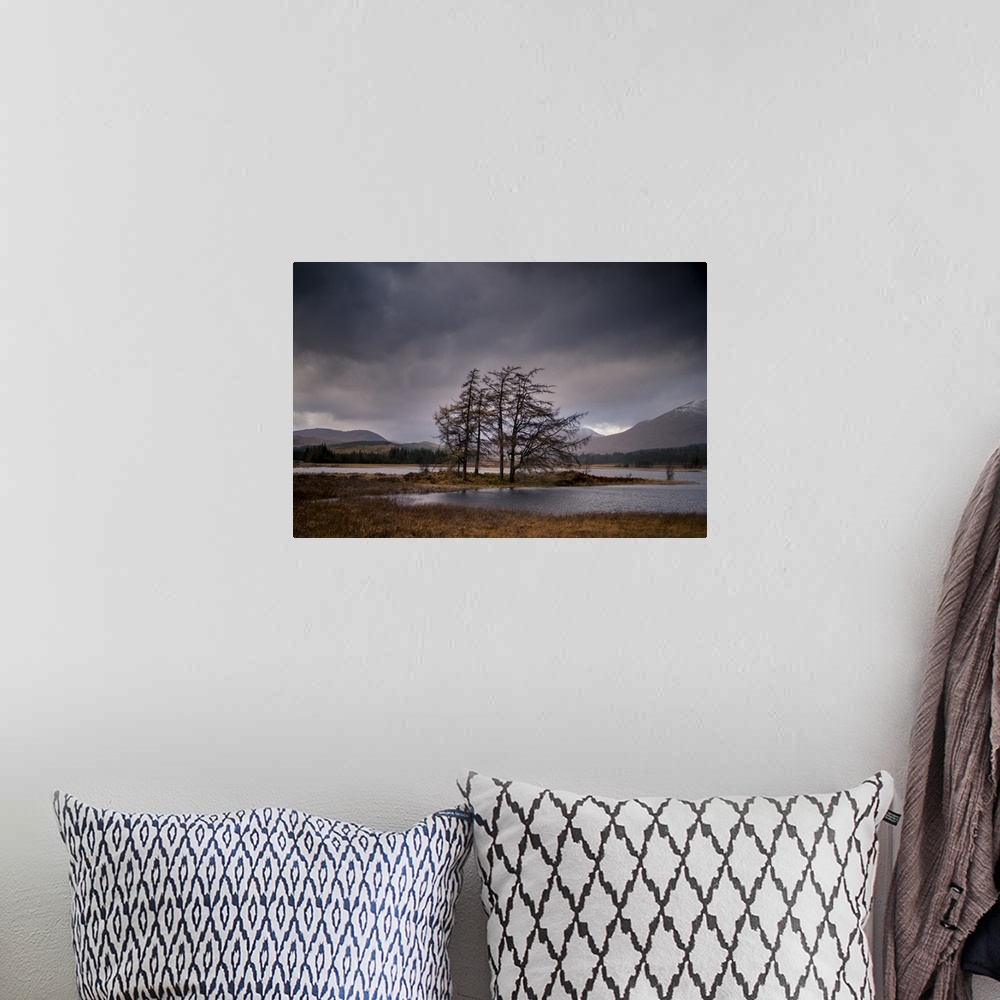 A bohemian room featuring Landscape photograph of Loch Tulla in Scotland with mountains in the background and an overcast sky.