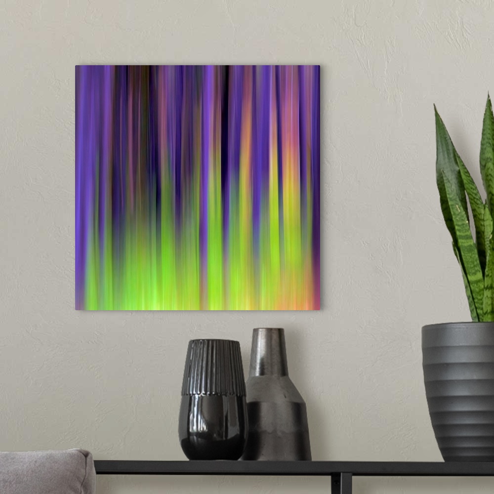 A modern room featuring Abstract photograph of vertical blurred stripes of color.