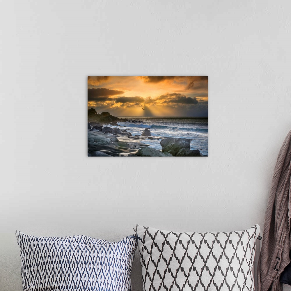 A bohemian room featuring Rocky coast of Lofoten, Norway, at sunset.