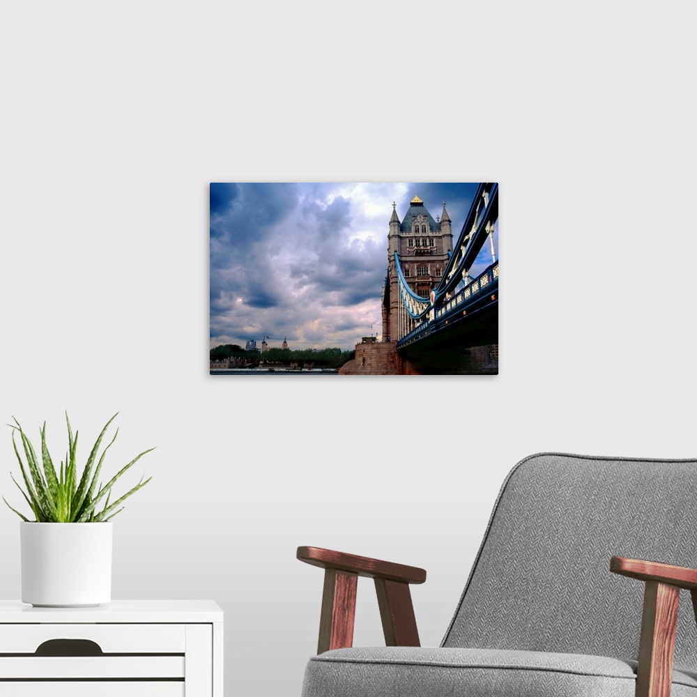 A modern room featuring Photograph from below of the Tower Bridge over the Thames River in London, Great Britain.