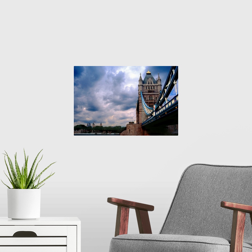 A modern room featuring Photograph from below of the Tower Bridge over the Thames River in London, Great Britain.