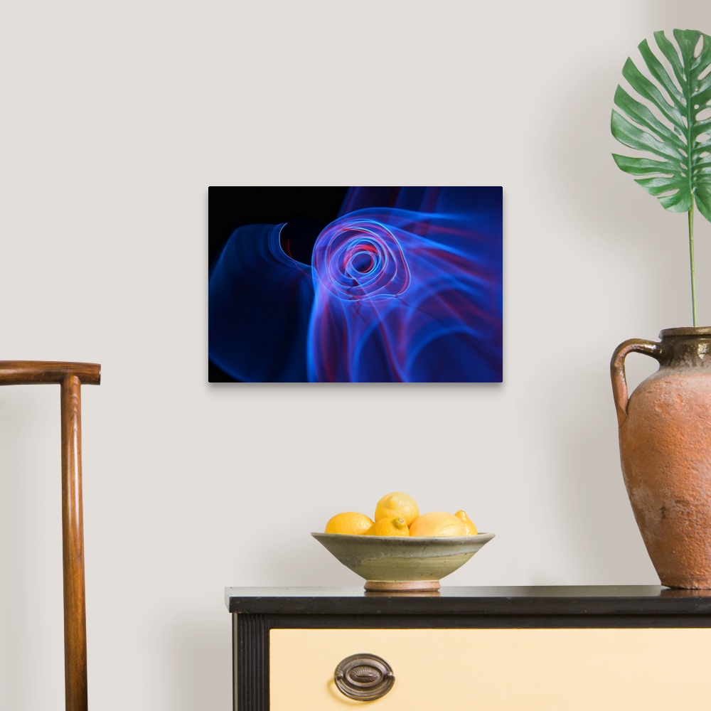 A traditional room featuring A macro photograph of an abstract shape in multiple colors against a black background.