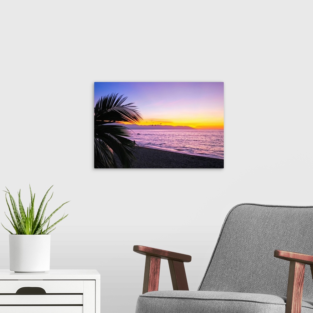 A modern room featuring Los Muertos beach Sunset, Puerto Vallarta, Mexico.