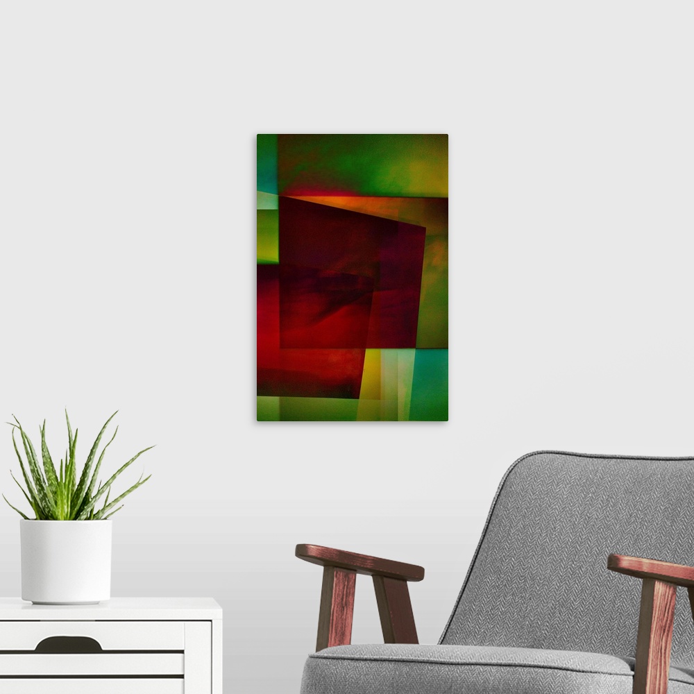 A modern room featuring Geometric abstract artwork that consists of deep reds and shades of green in polygonal shapes.