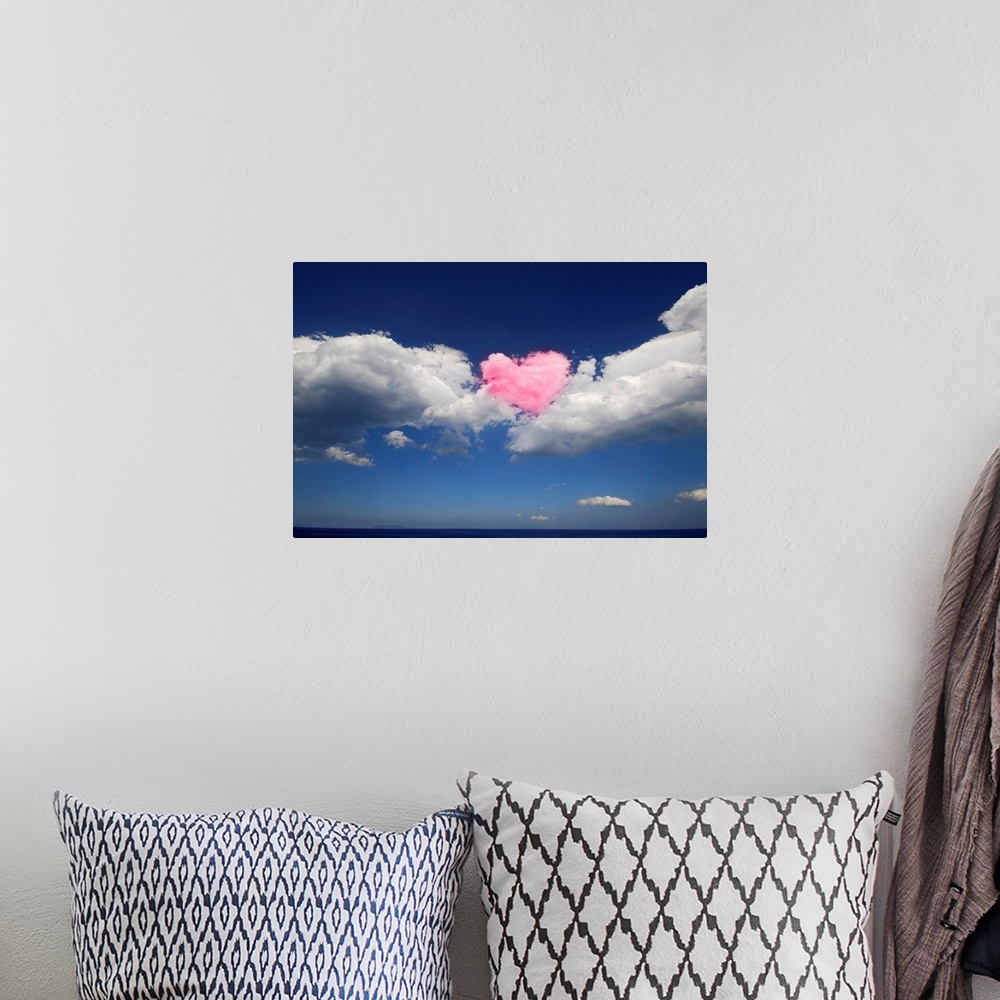 A bohemian room featuring This large piece shows immense clouds with a heart shaped cloud in the middle that has been color...