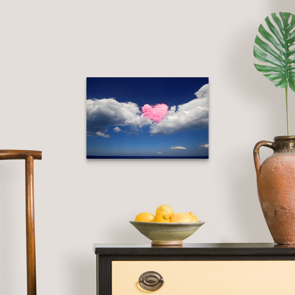 A traditional room featuring This large piece shows immense clouds with a heart shaped cloud in the middle that has been color...