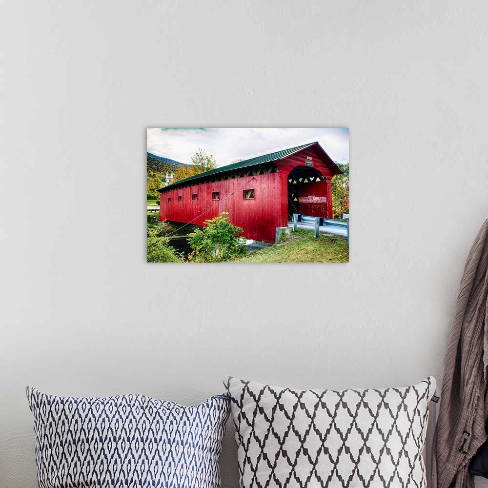A bohemian room featuring Fine art photo of a wooden covered bridge over the Battenkill River in New England.