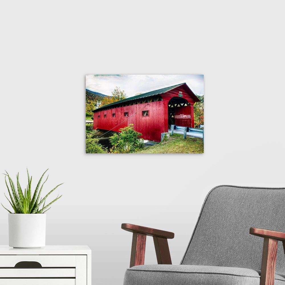 A modern room featuring Fine art photo of a wooden covered bridge over the Battenkill River in New England.